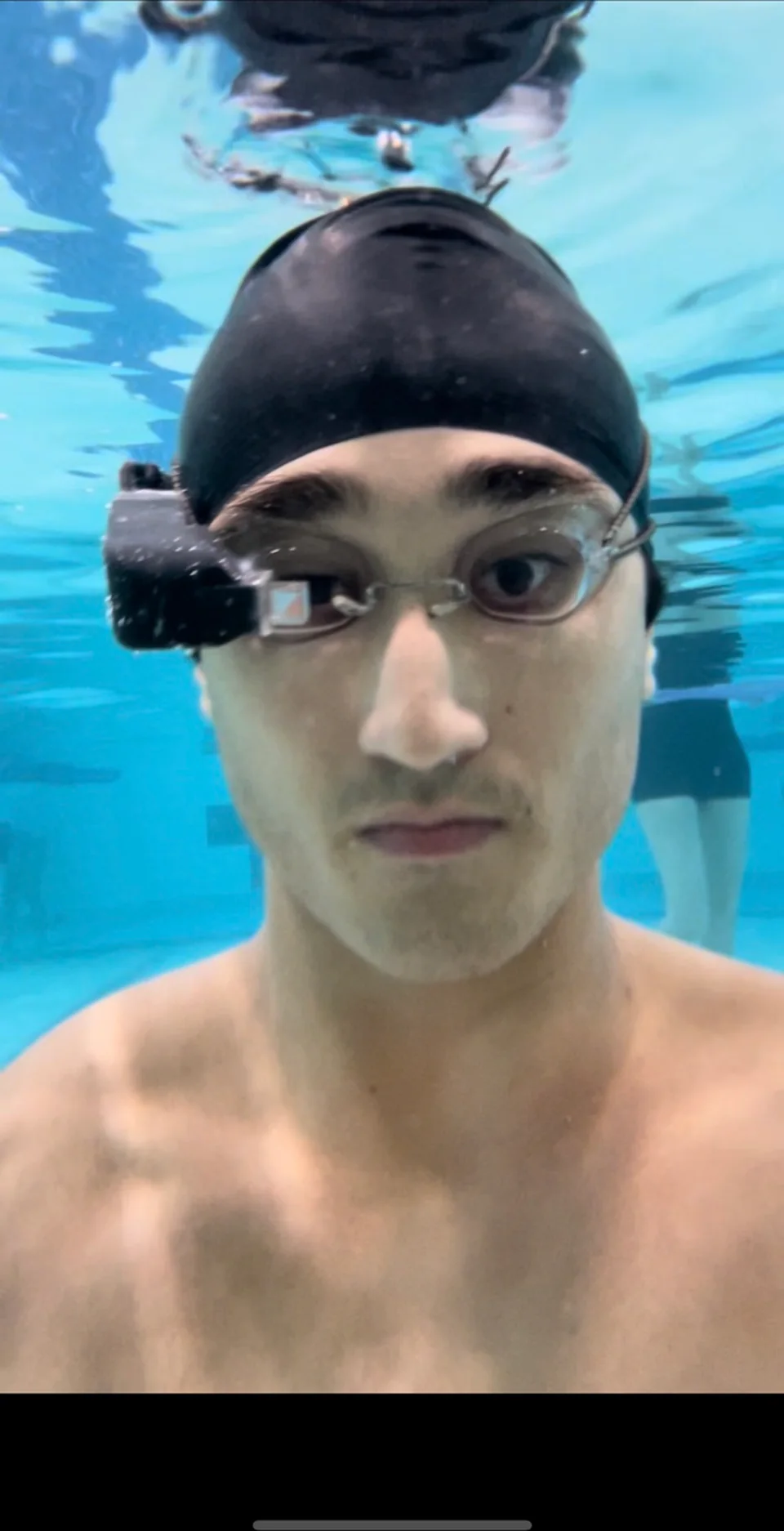 Sam underwater while wearing the movie-goggle optical module