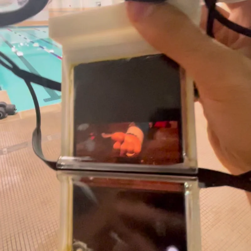 A movie frame visible through the working swim-goggle optics