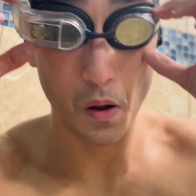 Sam putting on the working movie-goggle prototype at the pool