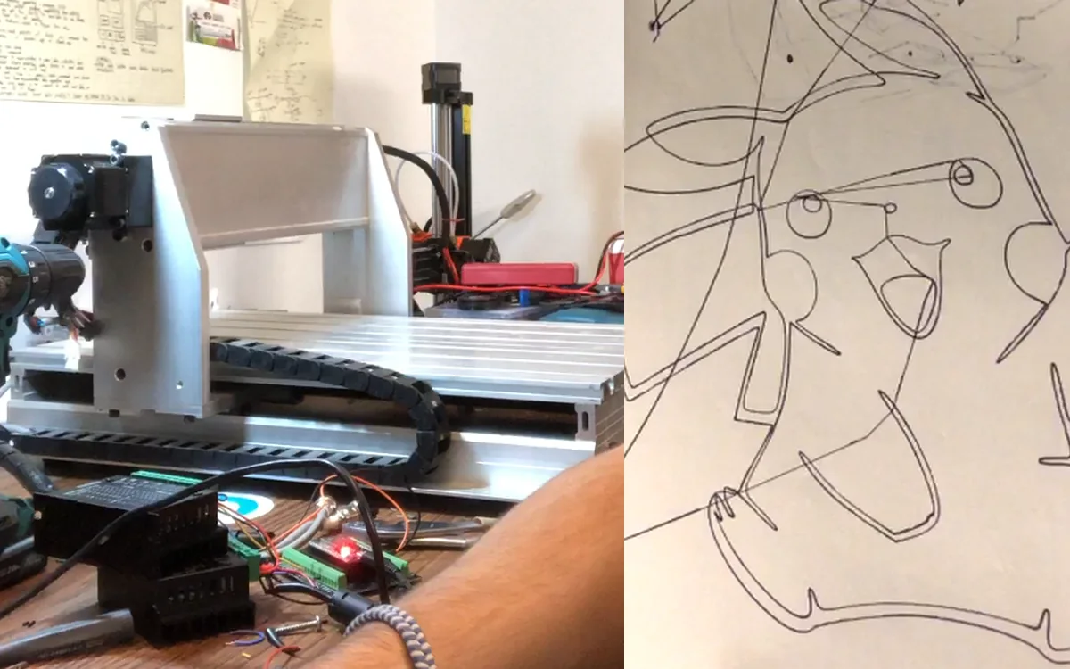 The converted CNC machine beside one of its plotted drawings
